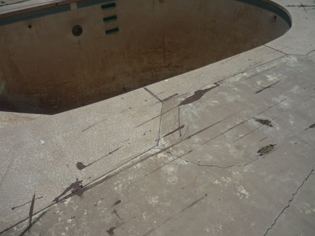 The original empty, run-down backyard swimming pool in Mesa, Arizona before it became a Garden Pool